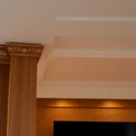 High-quality finish trim installed on walls and ceilings, emphasizing craftsmanship and smooth surface detail for elegant home interiors.